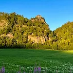 With Views Of River And Mountains